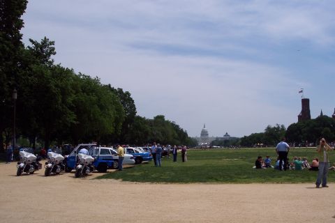 2001 Ford Crown Victoria - Police vehicles are parked on the National Mall with the Capitol building visible in the distance.
