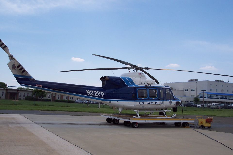 Blue and white U.S. Park Police helicopter with registration N22PP on a trailer