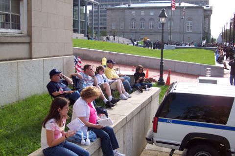 2001 Ford Crown Victoria - Sitting across the street from the memorial, waiting for the busses with the survivors onboard to arrive.