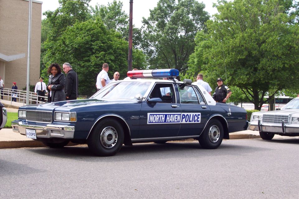 Dark blue police car with "NORTH HAVEN POLICE" text and light bar