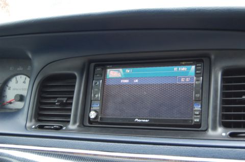 1985 Mercury Grand Marquis - Dashboard view showing an aftermarket Pioneer stereo and the vehicle's speedometer.