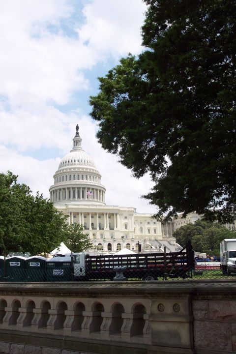 2001 Ford Crown Victoria - A truck and trailer are visible in front of the US Capitol building on a cloudy day.