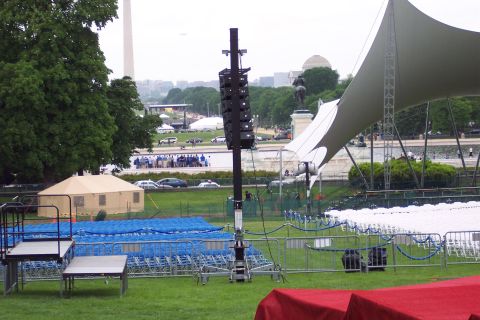 2001 Ford Crown Victoria - An outdoor event is being set up on the National Mall, with the Washington Monument and Capitol dome visible in the distance.