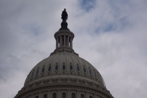 2001 Ford Crown Victoria - The dome of the US Capitol building is visible against a cloudy sky.