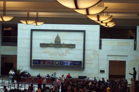 2001 Ford Crown Victoria - The United States Capitol Visitor Center interior, showing a large display and many visitors.
