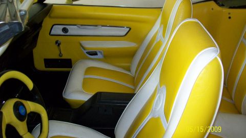 1973 Mercury Cougar - Custom interior with yellow and white upholstery and a unique steering wheel.