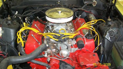 1973 Mercury Cougar - The engine bay of a vehicle, showing the V8 engine components and wiring.