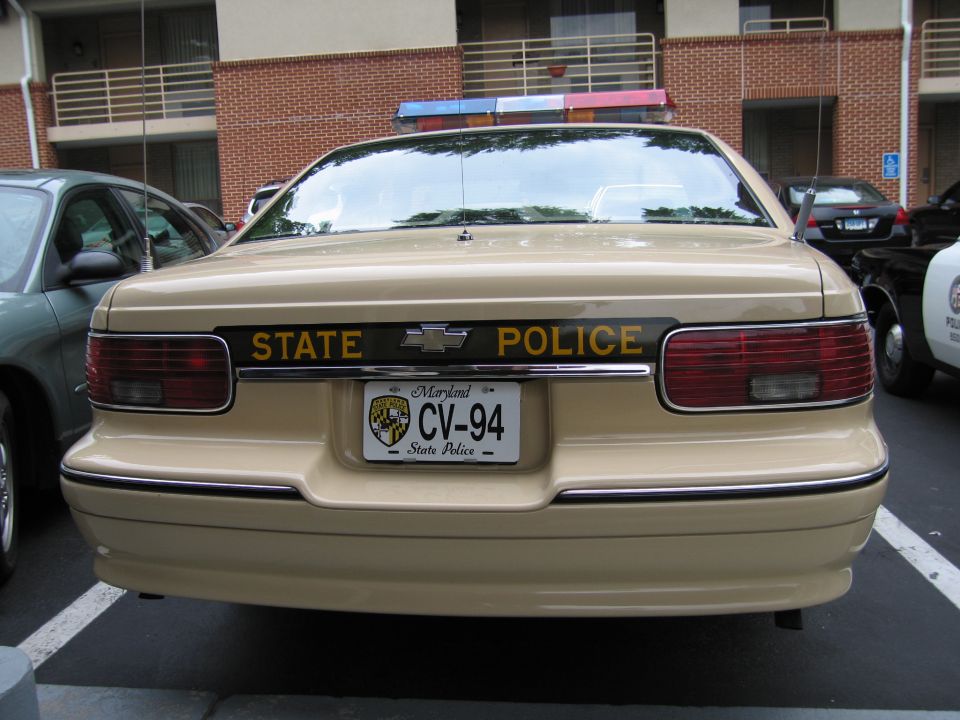 Rear of tan Chevrolet State Police Caprice with Maryland plate CV-94 and STATE POLICE lettering