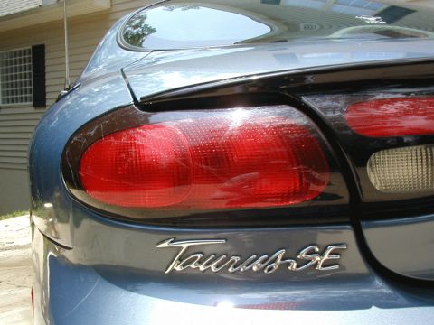 1999 Ford Taurus - Rear view of a 1999 Ford Taurus, focusing on the taillight.