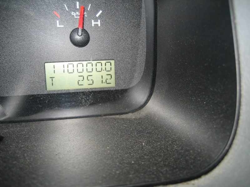 Odometer LCD showing 110000 miles and trip 251.2 under a temperature gauge