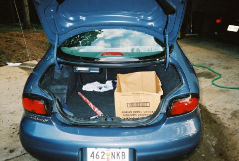 1999 Ford Taurus - Trunk of a 1999 Ford Taurus loaded with items.