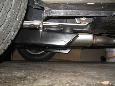 1968 Shelby GT500 - Close-up of the undercarriage, focusing on the traction bars and exhaust components.