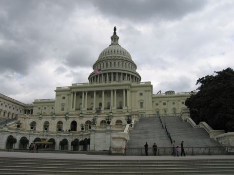 1991 Ford LTD Crown Victoria - U.S. Capitol building and its central dome rise above the wide front steps under an overcast sky.