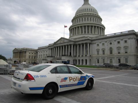 1991 Ford LTD Crown Victoria - white United States Capitol Police Chevrolet sedan marked Police 228-2800 sits parked before the Capitol.