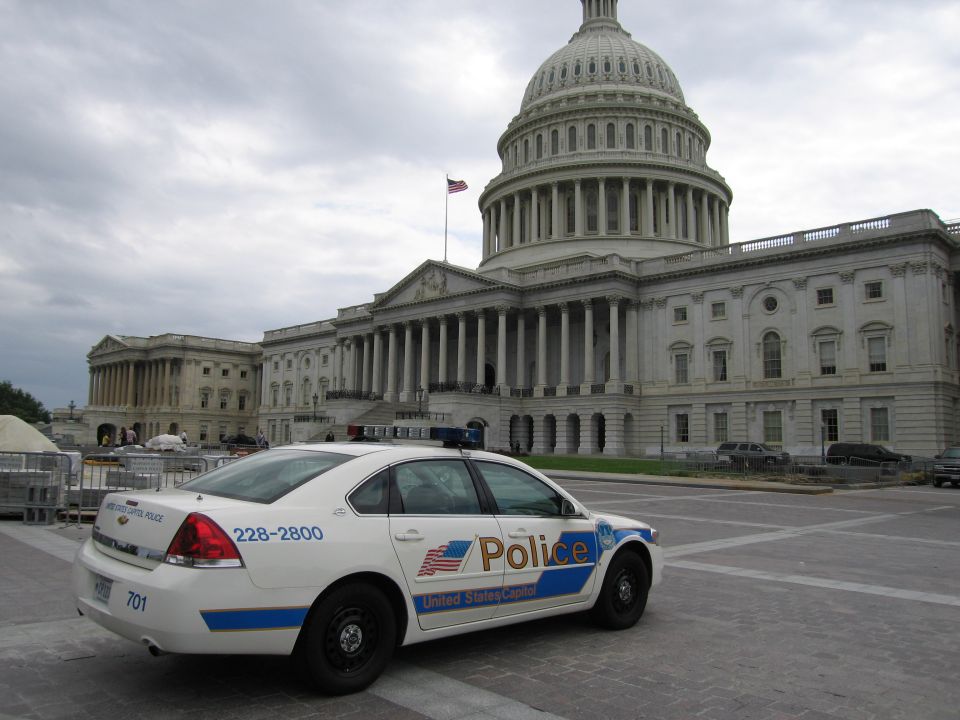White Capitol Police Chevrolet sedan parked in front of the U.S. Capitol