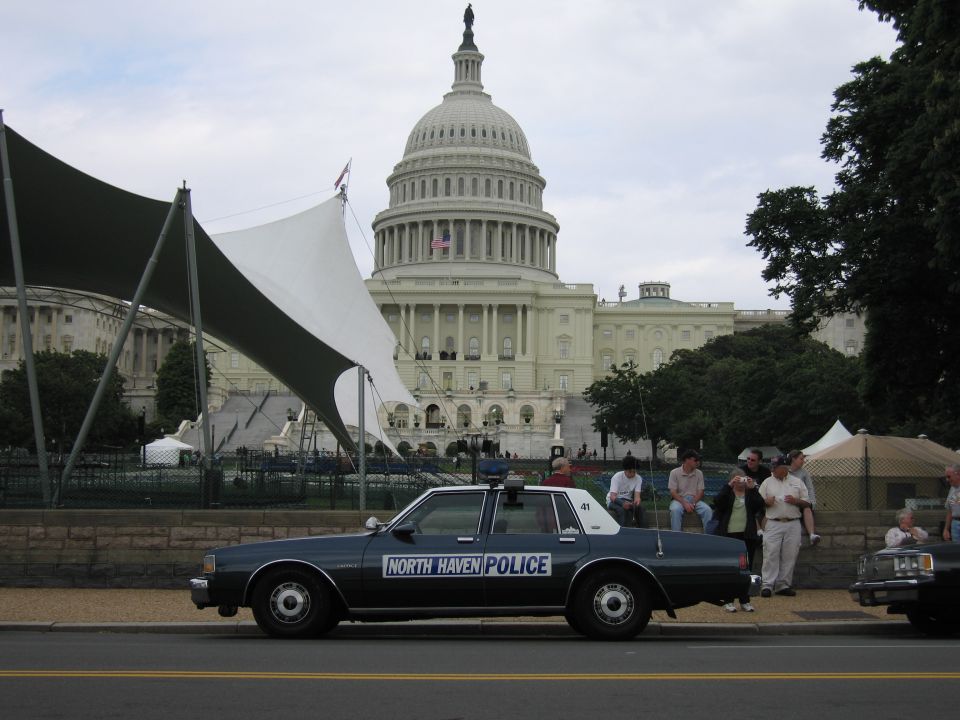 Dark blue North Haven Police sedan parked before the U.S. Capitol