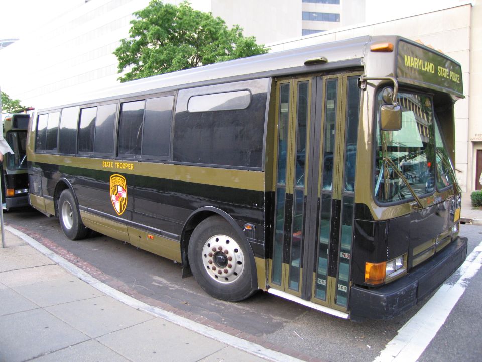 Maryland State Police trooper bus, front three-quarter view at curb