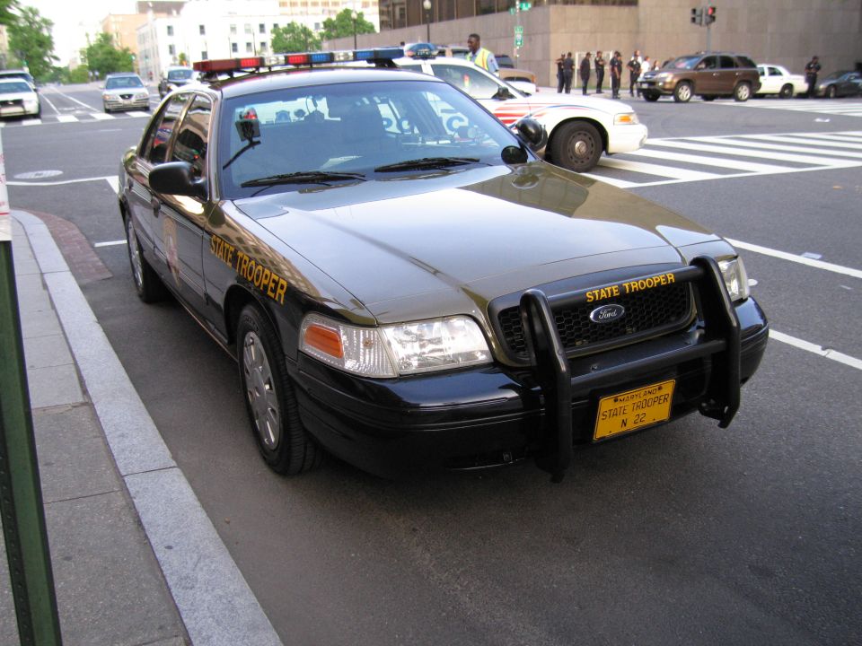 Maryland State Trooper Ford sedan with brush guard at a curb