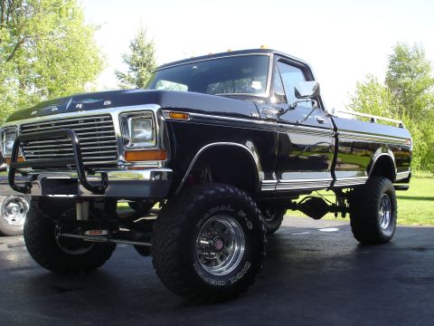 1979 Ford F-250 - This lifted 1979 Ford F-250 pickup truck is shown from a three-quarter front angle.
