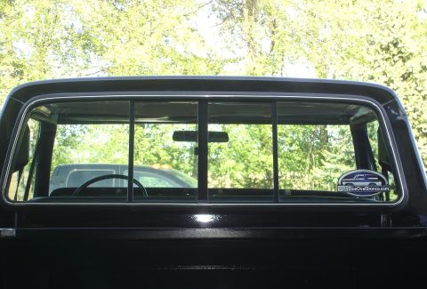 1979 Ford F-250 - A sticker on the rear window reads "TheBlueOvalBronco.com" and shows a graphic of a Bronco.