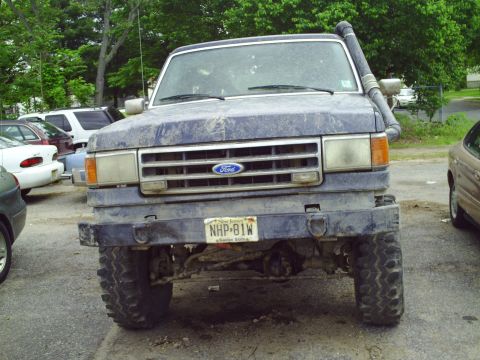 1990 Ford Bronco - This 1990 Ford Bronco features a snorkel, indicating off-road use. The front grille and overall body style are consistent with the model ye…