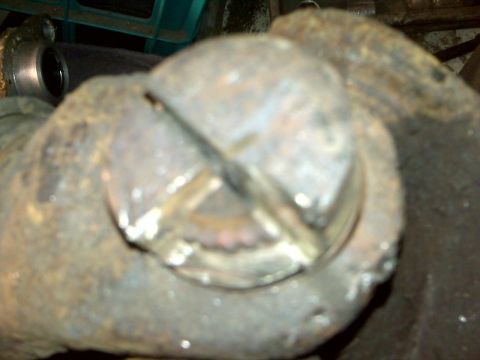 1995 Ford Bronco - A heavily corroded metal part is shown in detail, with visible signs of wear and tear.