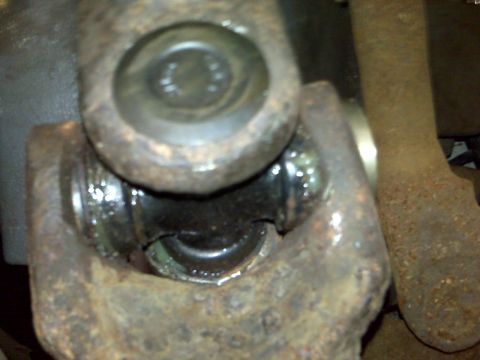 1995 Ford Bronco - This photo shows a rusted universal joint, likely from a vehicle's drivetrain.