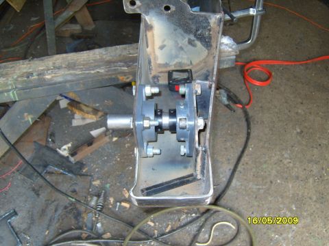 1989 Ford Bronco - This image shows a close-up of a vehicle bumper part with attached hardware and a small electronic component.
