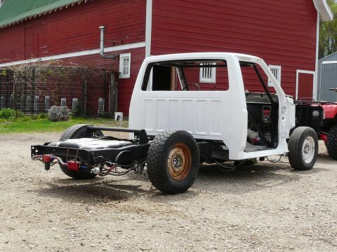 1994 Ford F-150 - This truck is missing its bed and appears to be undergoing some work or restoration.