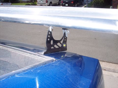 1971 Ford Mustang - A black spoiler mount is attached to the trunk of a blue car.