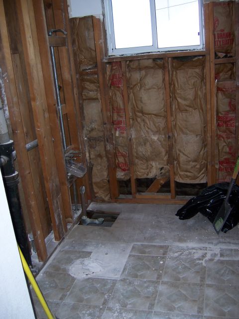 1991 Ford Bronco - This bathroom is undergoing renovations, with exposed wall studs and insulation visible.