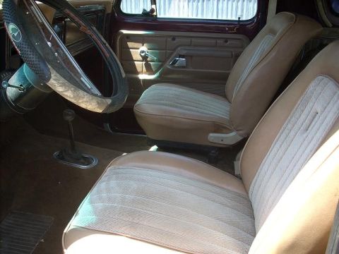 1979 Ford Bronco - Interior view of a 1978 Ford Bronco, showing the seats, steering wheel, and gear shifter.