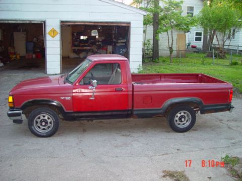 1989 Ford Ranger - Rusty driver side view with new door on.