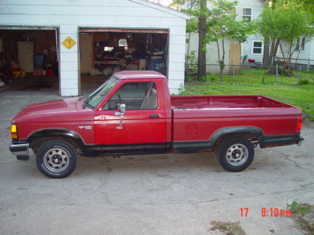 Rusty driver side view with new door on.