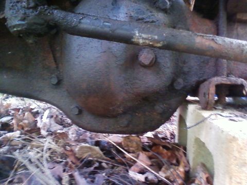 1990 Ford Bronco - Close-up view of the differential housing and associated suspension components, showing signs of wear and age.
