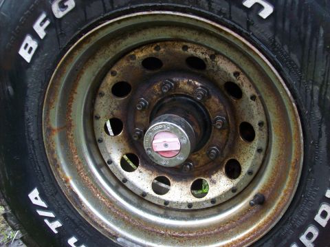 1985 Ford F-250 - This image shows a close-up of a rusty wheel and BFGoodrich tires, a "LOCK" hub. The registry claim of a 1985 Ford F-250 is not supported b…