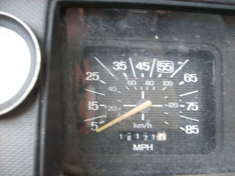 1985 Ford F-250 - Close-up of the dashboard of a 1985 Ford F-250, displaying the speedometer and odometer.
