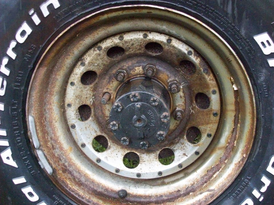 Close-up of a rusty wheel with BFGoodrich All-Terrain tire