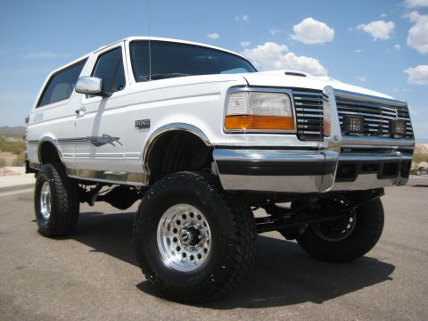 1996 Ford Bronco - This lifted 1996 Ford Bronco features aftermarket chrome wheels and a prominent grille guard.