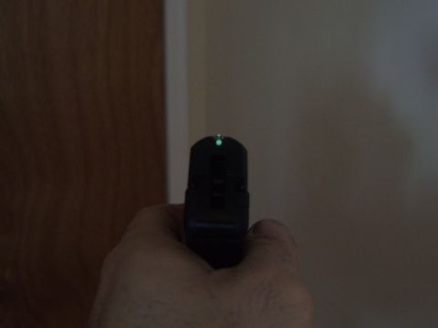 2002 Jeep TJ - Pistol front sight with green dot is visible in this close-up shot.