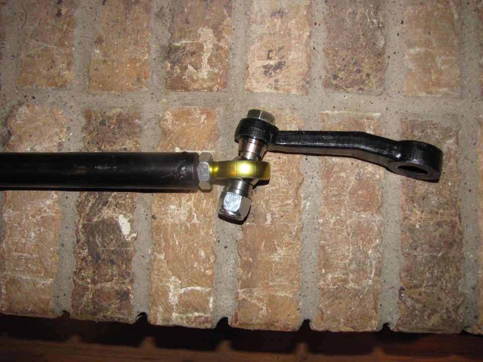 Close-up of a steering linkage rod with a ball joint and a tie rod end