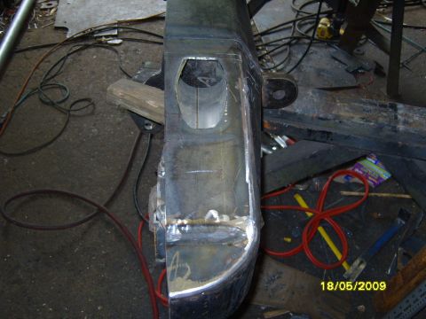 1989 Ford Bronco - This image shows a custom-fabricated rear bumper section, likely for a truck or SUV, with visible welding and cutouts for potential compone…