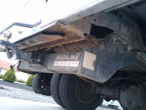 1994 Ford Bronco - Rear axle and hitch assembly with 'MAGNUM V' branding visible on the undercarriage.