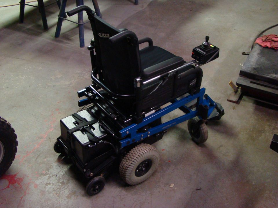 Quickie electric wheelchair with joystick control and large rear wheels