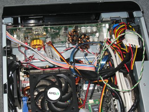 2007 Subaru Impreza - Close-up view of the internal components of a computer, including a CPU cooler and various wires.