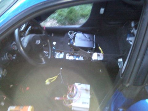 2007 Subaru Impreza - Dashboard removed, exposing wiring and electronic modules inside a vehicle's interior.