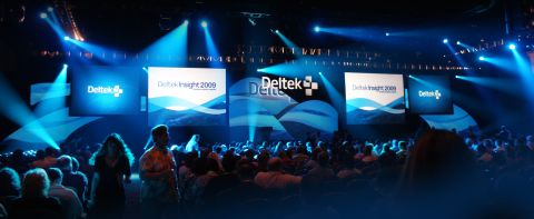 1966 Ford Bronco - A large conference event with "Deltek Insight 2009" branding visible on multiple screens.