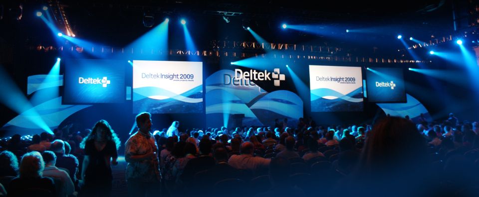 Conference stage with "Deltek Insight 2009" displayed on screens