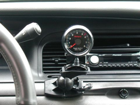 2003 Ford Crown Victoria - That's a cheap surround sound speaker wall mount under TACH!