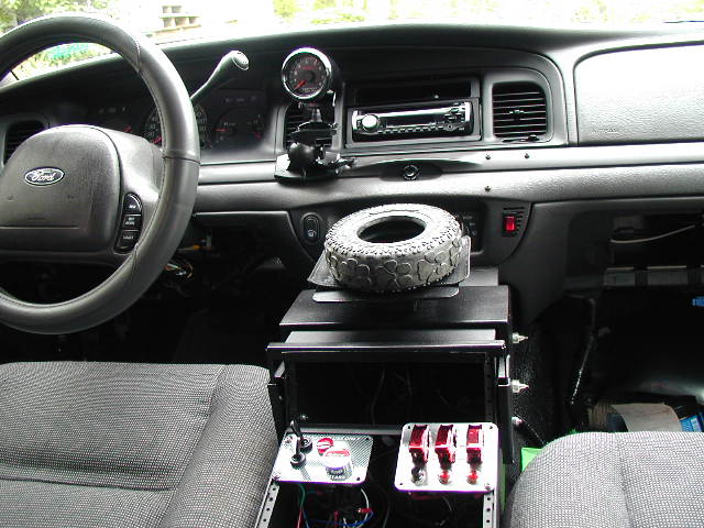 That big red button starts the car and also puts car in "pits-stop" mode.